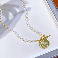 Natural pearl necklace with gold coin pendant