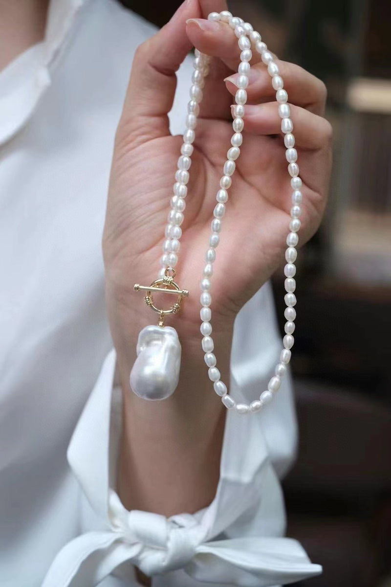 Natural pearl necklace with unique baroque pendant